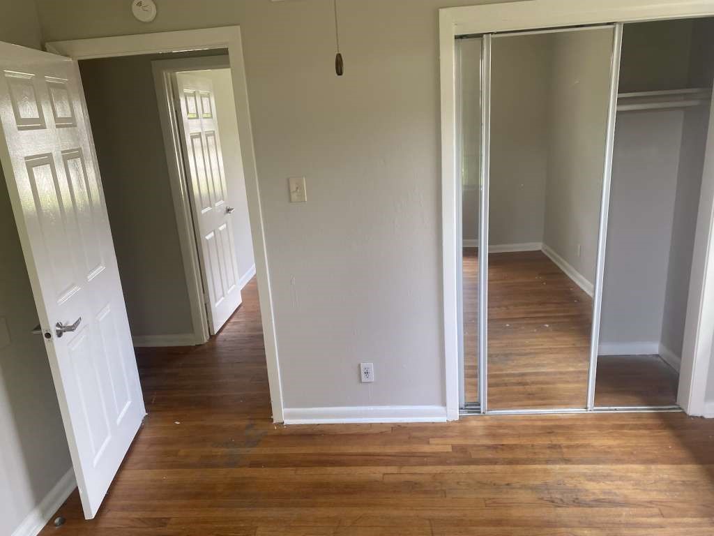205 West Rittenhouse Street Houston, TX 77076 - Photo 11 of 13 a view of a hallway with wooden floor and staircase