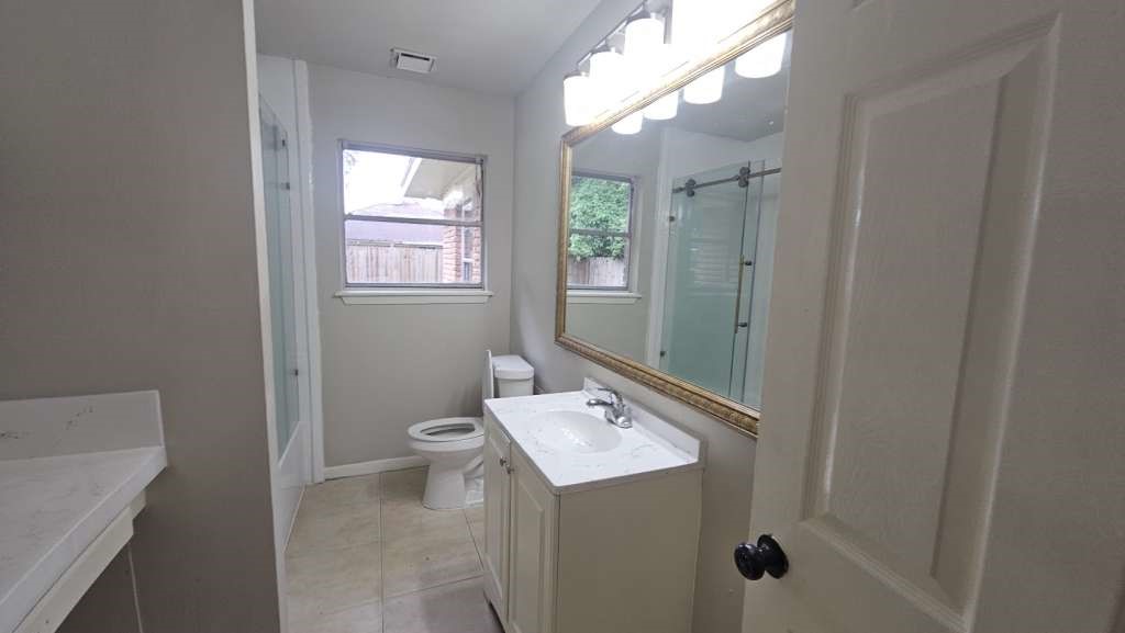 205 West Rittenhouse Street Houston, TX 77076 - Photo 8 of 13 a bathroom with a sink a toilet and shower