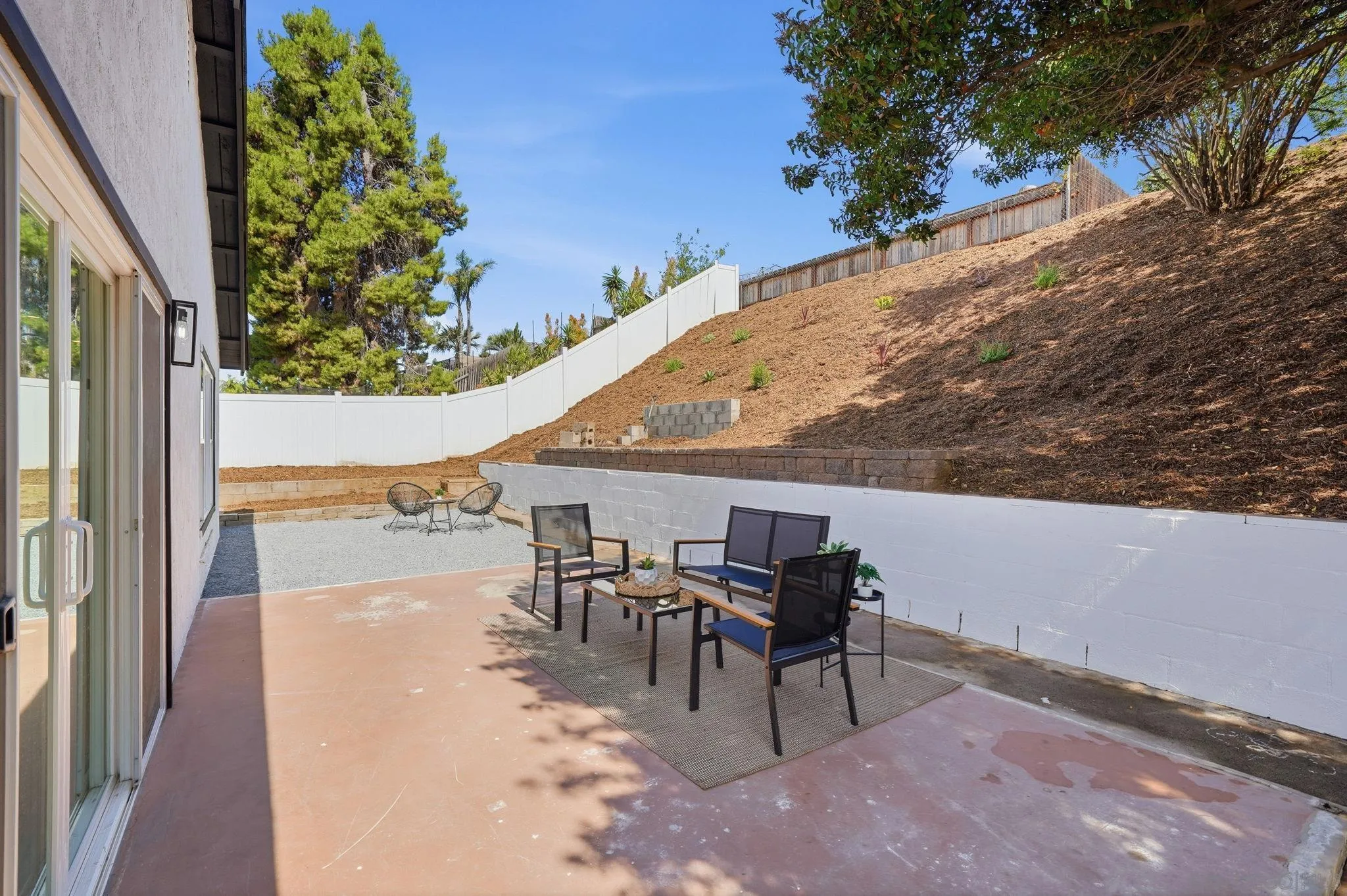 10440 Bosque Drive Lakeside, CA 92040 - Photo 45 of 47 a view of a patio with table and chairs and potted plants