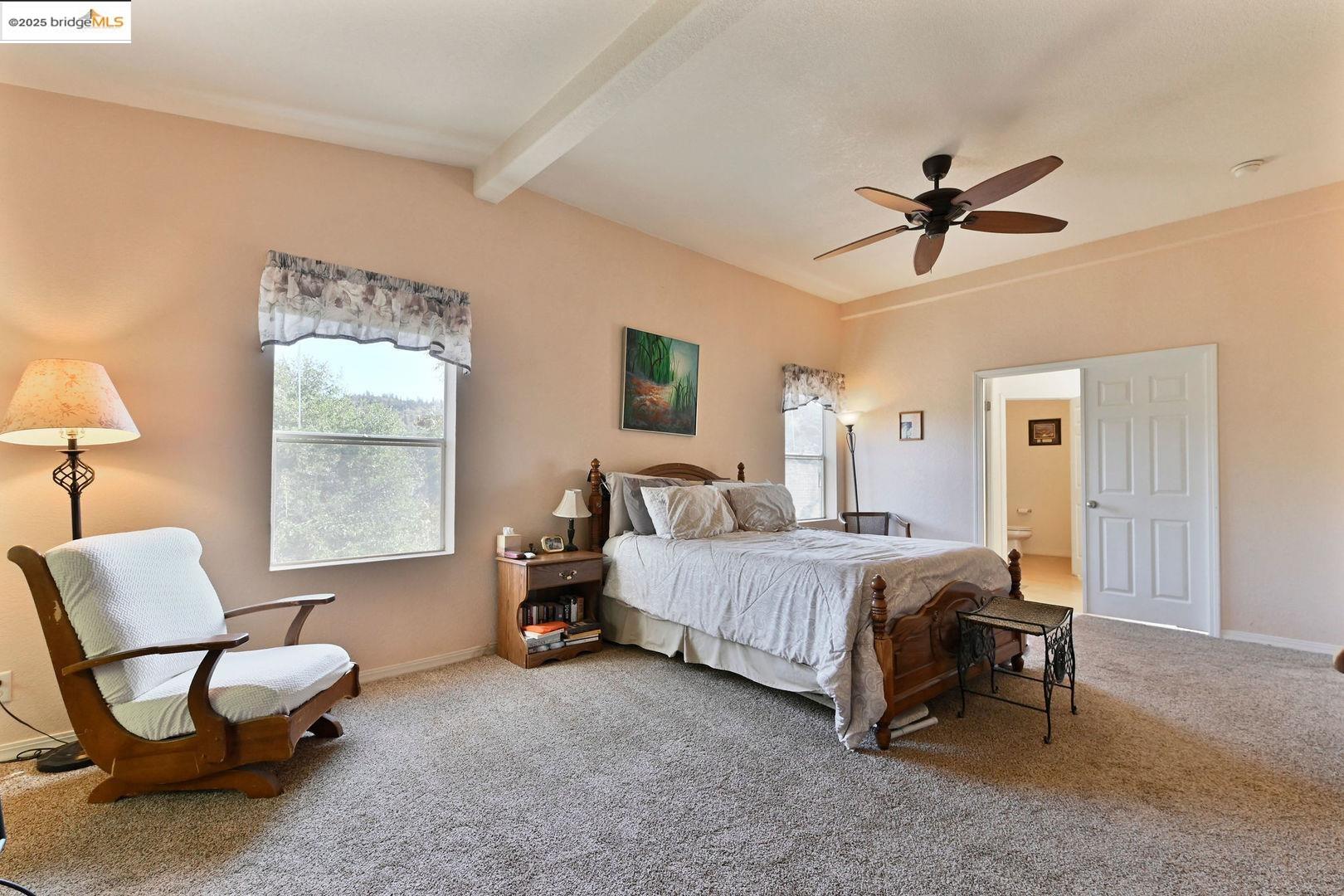 3770 Sheep Ranch Road Murphys, CA 95247 - Photo 23 of 60 a bed room with a bed and a chair