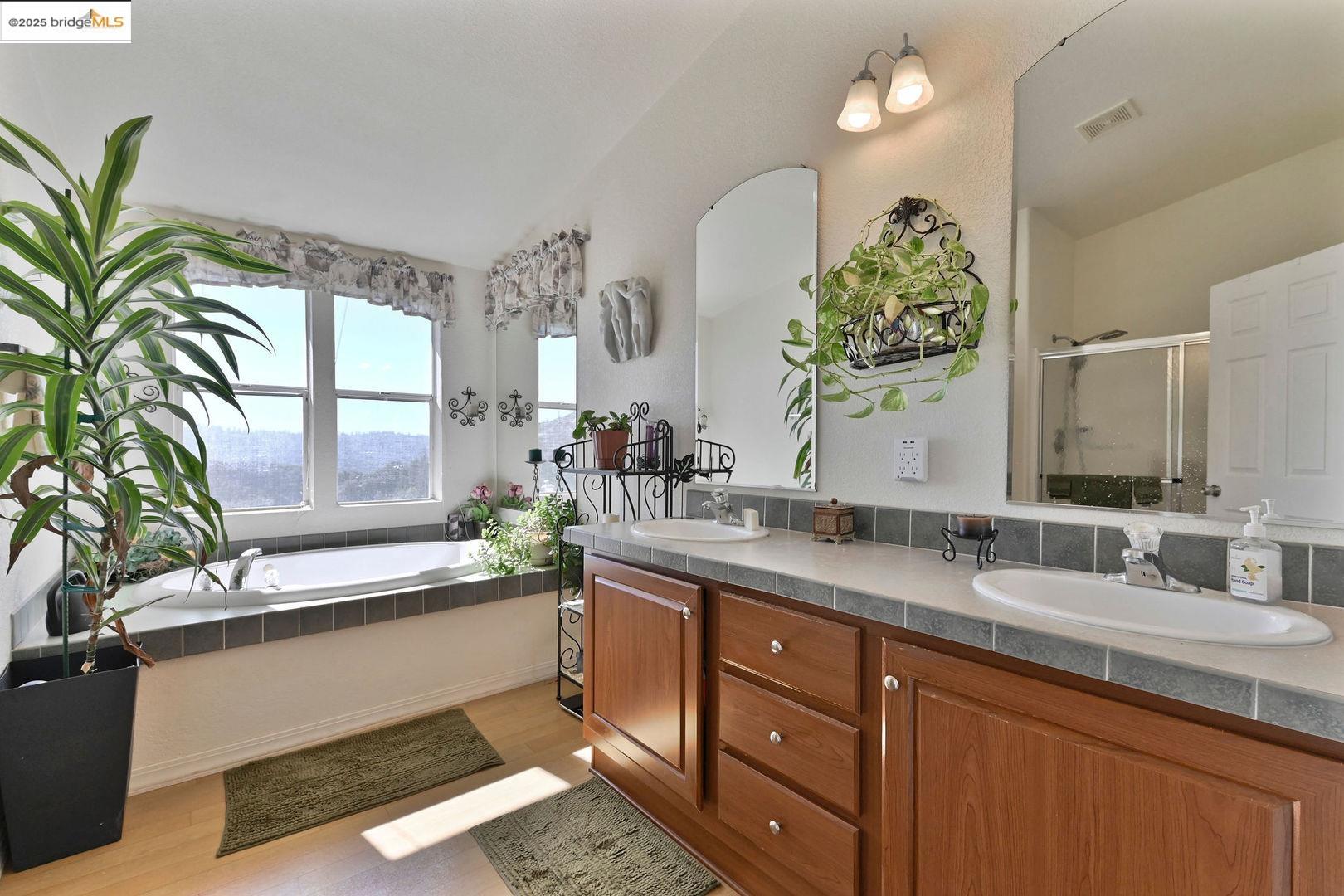 3770 Sheep Ranch Road Murphys, CA 95247 - Photo 27 of 60 a bathroom with a double vanity sink and a mirror