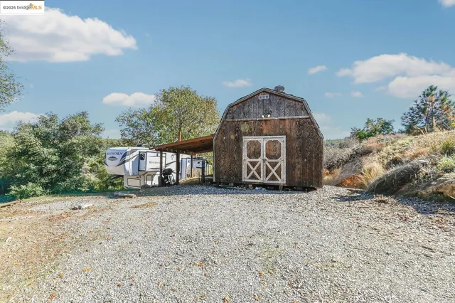 a kitchen with a table and chairs