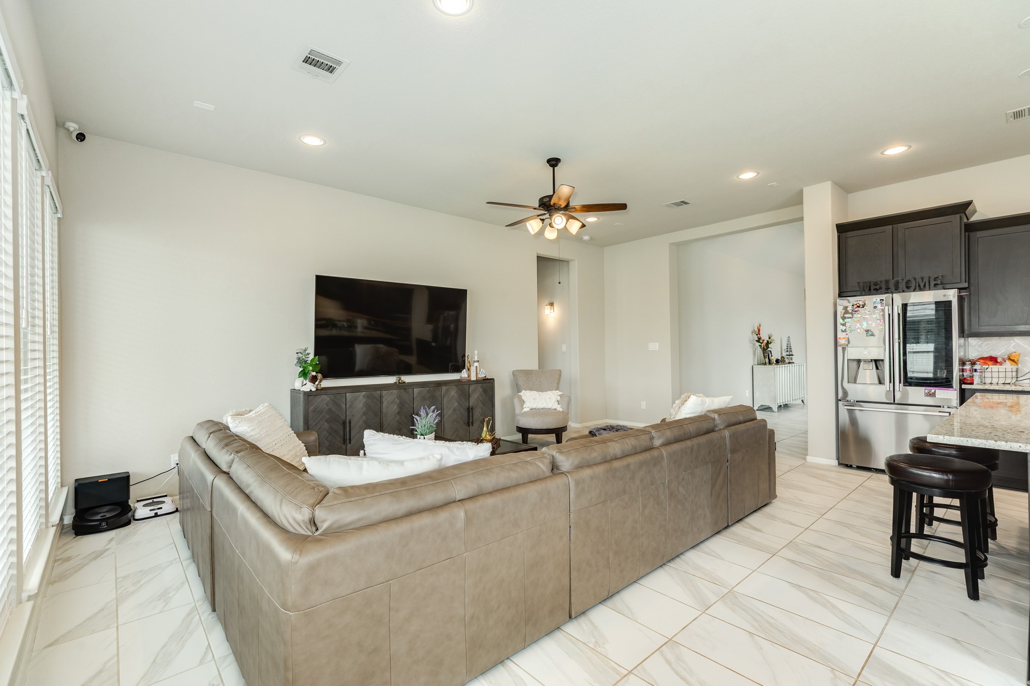 5138 Walnut Grv Lane Manvel, TX 77578 - Photo 10 of 43 a living room with furniture and a flat screen tv