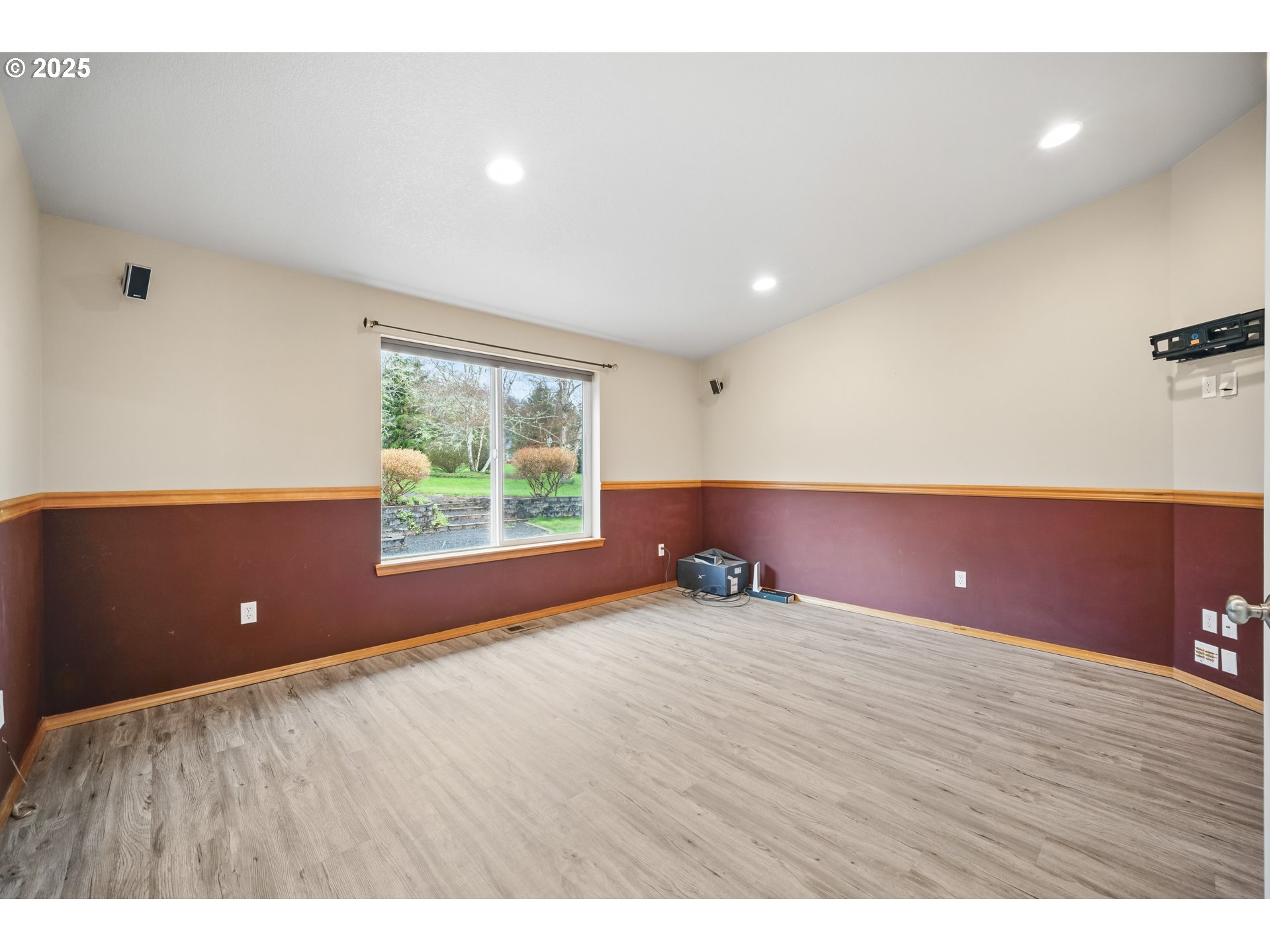 23 Elk Ridge Drive Cathlamet, WA 98612 - Photo 12 of 46 a view of an empty room with wooden floor and a window