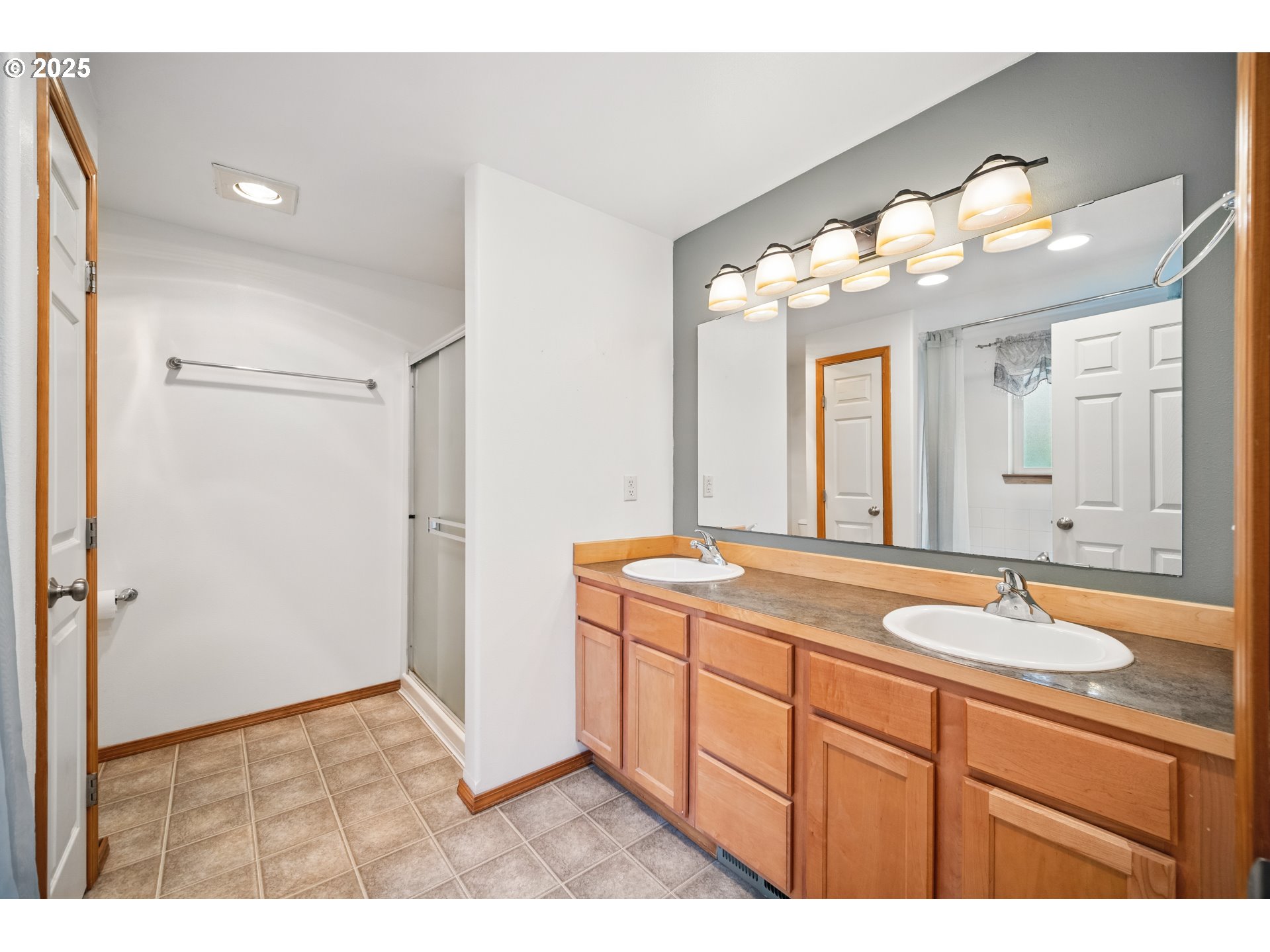 23 Elk Ridge Drive Cathlamet, WA 98612 - Photo 16 of 46 a bathroom with a sink vanity and a mirror