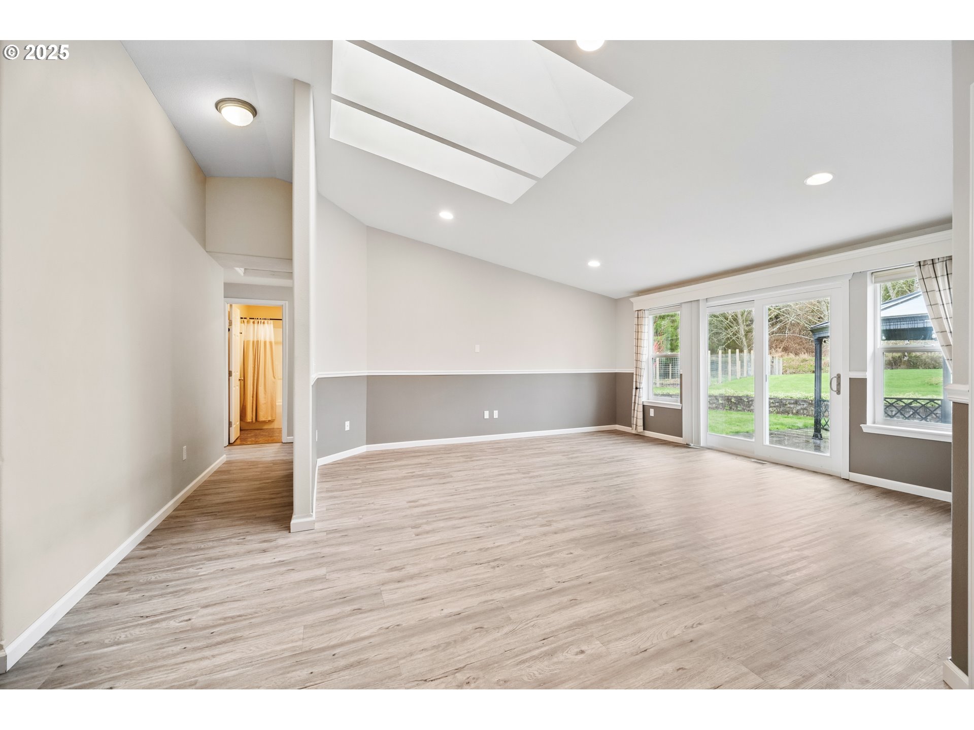 23 Elk Ridge Drive Cathlamet, WA 98612 - Photo 19 of 46 a view of an empty room with wooden floor and a window