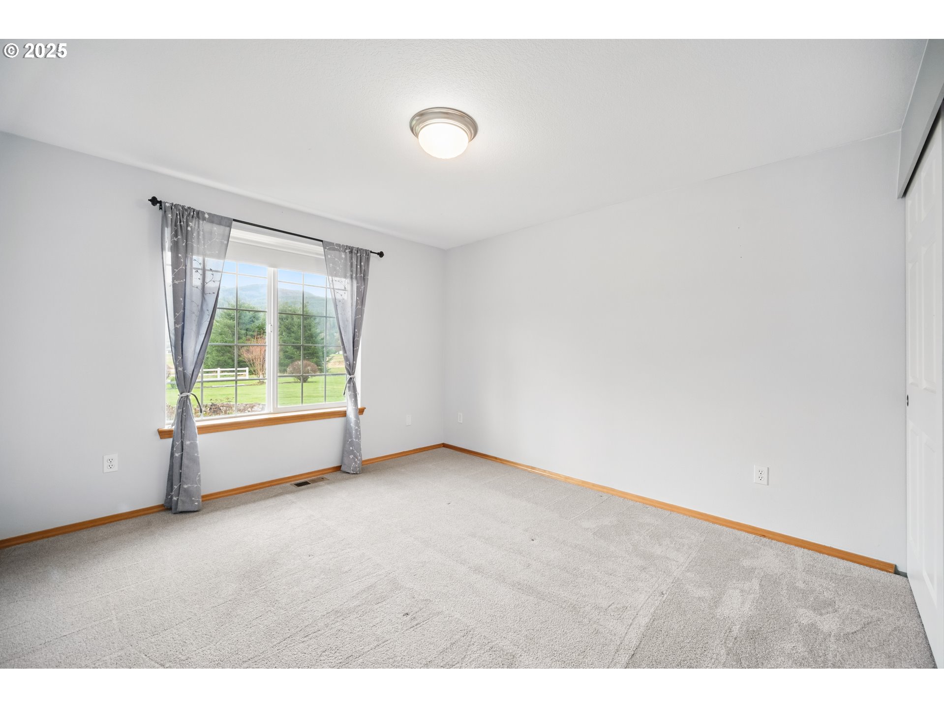 23 Elk Ridge Drive Cathlamet, WA 98612 - Photo 21 of 46 a view of an empty room with a window