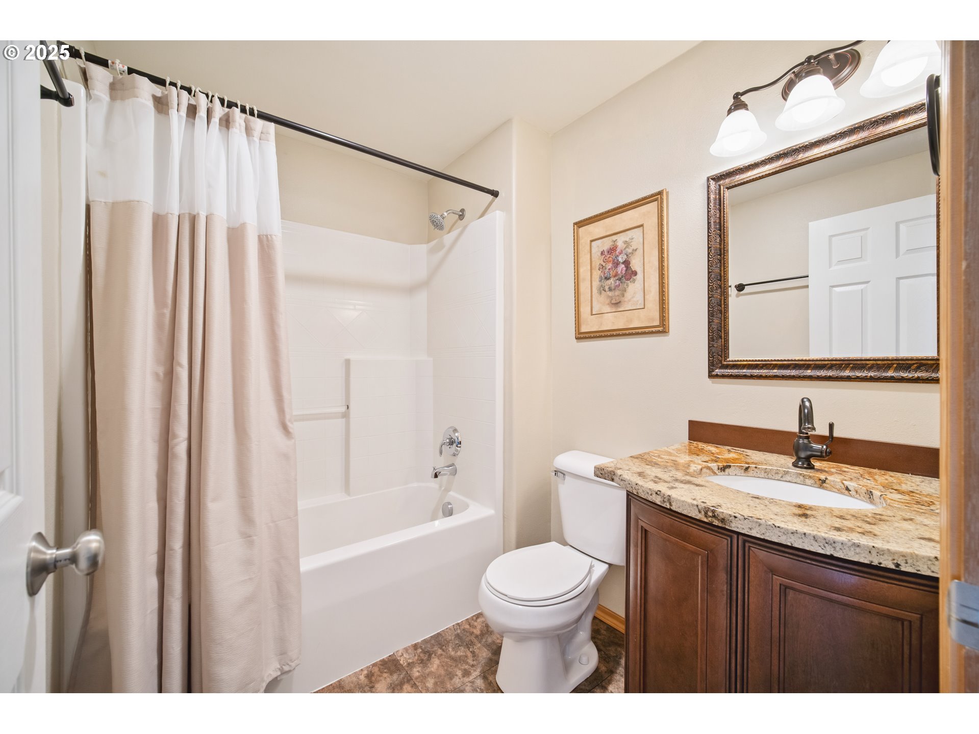 23 Elk Ridge Drive Cathlamet, WA 98612 - Photo 23 of 46 a bathroom with a granite countertop sink toilet a mirror a bathtub and shower