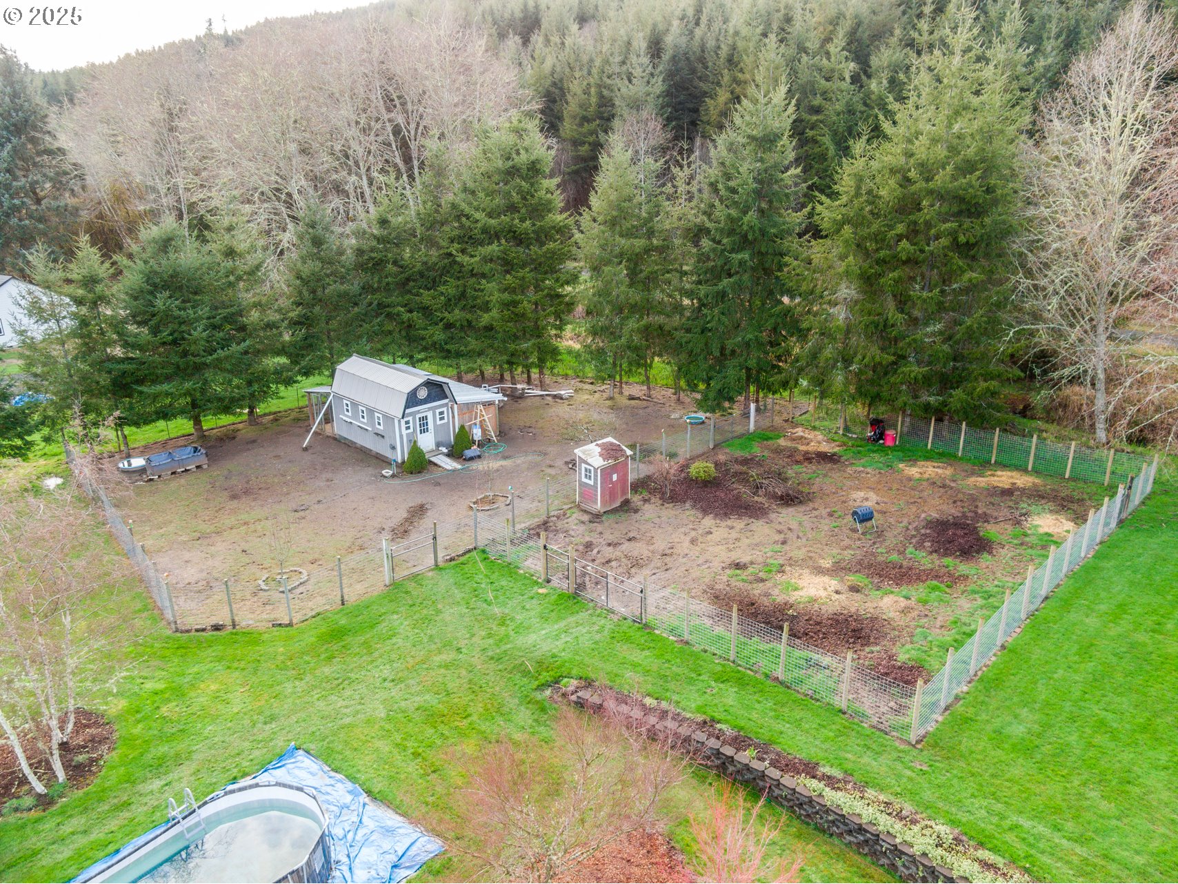 23 Elk Ridge Drive Cathlamet, WA 98612 - Photo 29 of 46 a backyard of a house with table and chairs