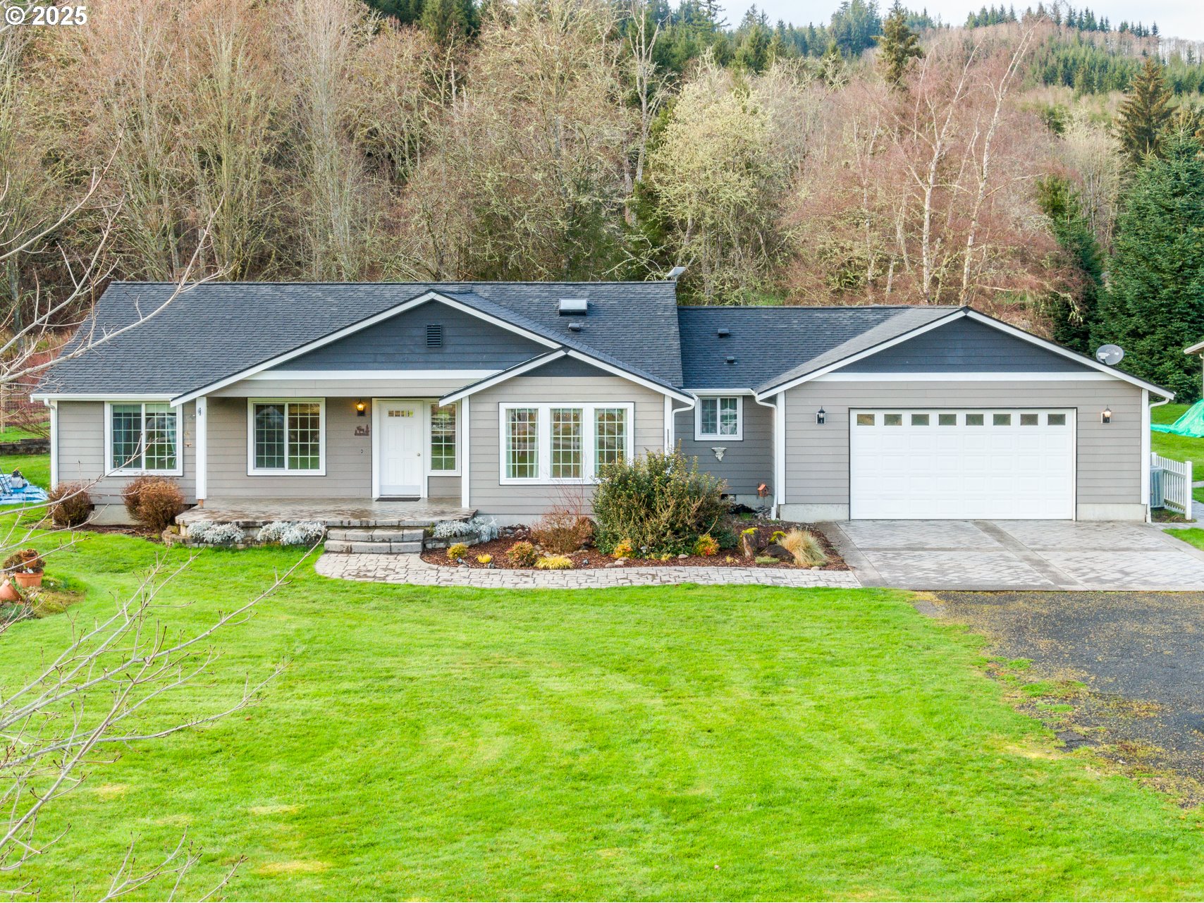 23 Elk Ridge Drive Cathlamet, WA 98612 - Photo 30 of 46 a front view of a house with a yard