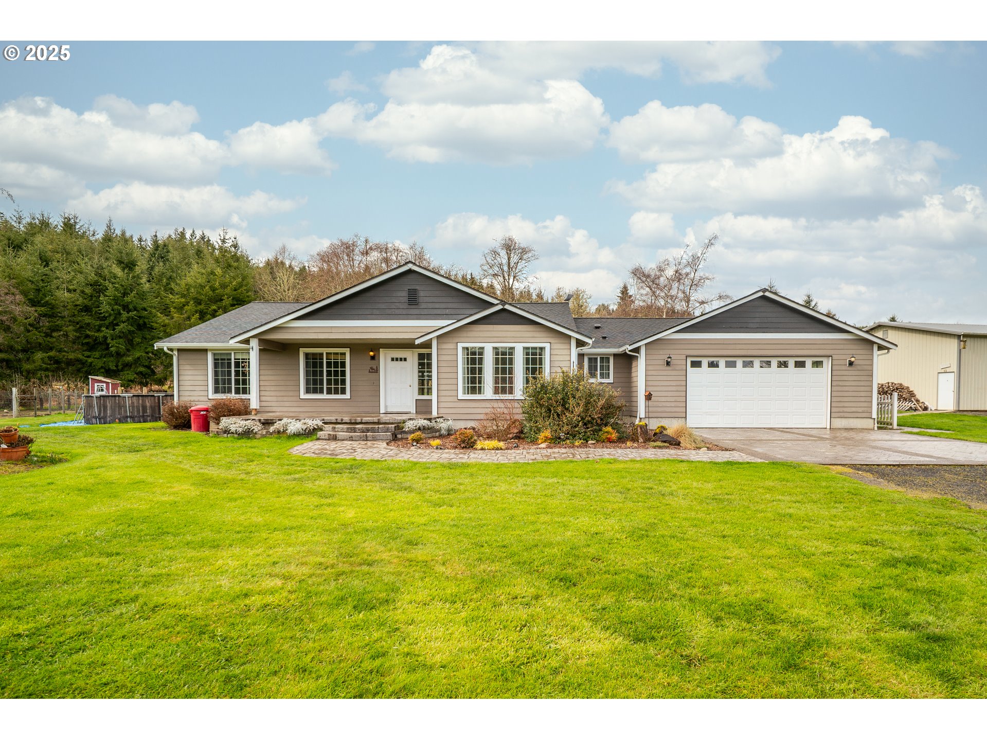 23 Elk Ridge Drive Cathlamet, WA 98612 - Photo 3 of 46 a front view of a house with yard and porch