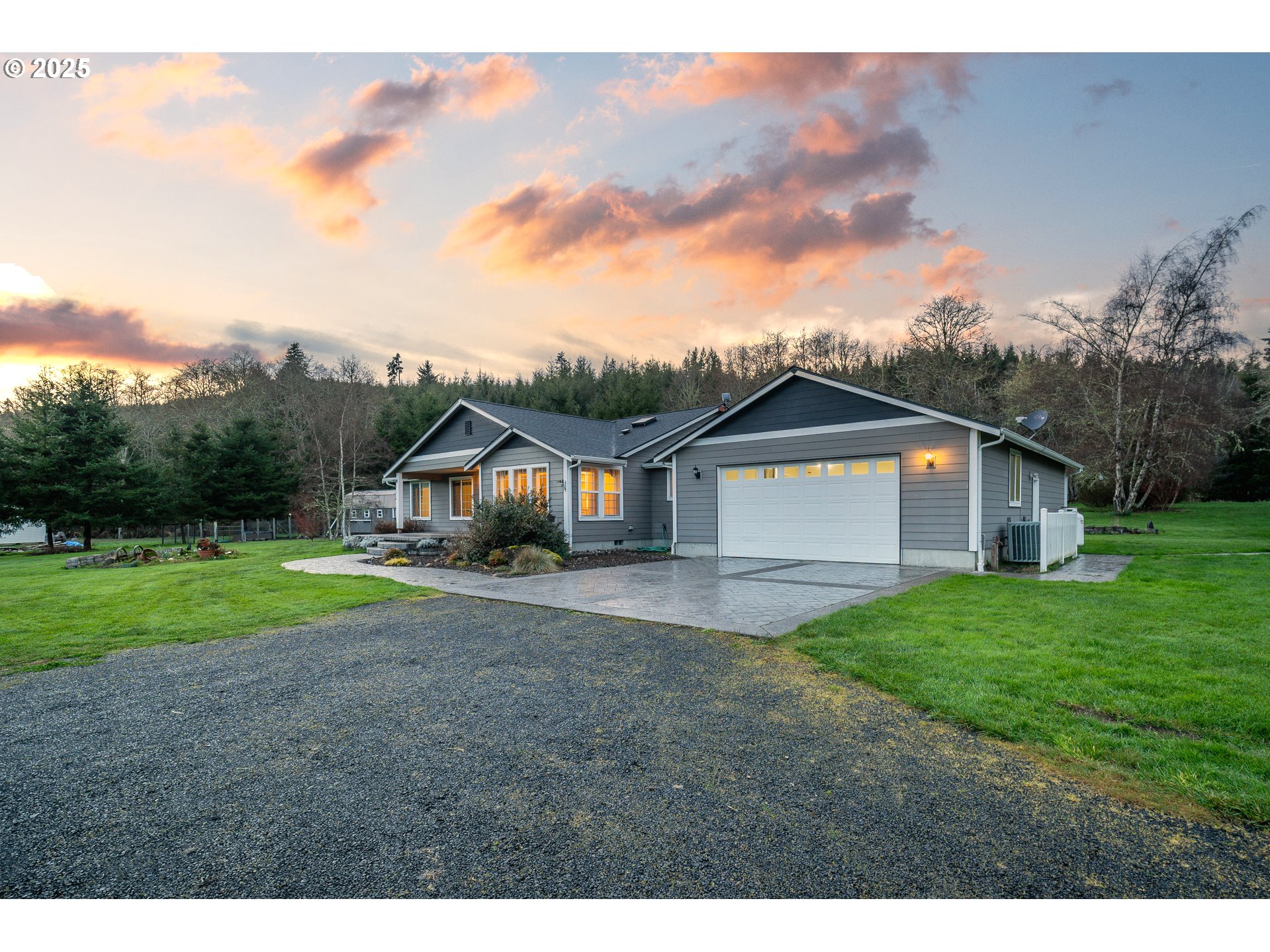 23 Elk Ridge Drive Cathlamet, WA 98612 - Photo 35 of 46 a front view of a house with a yard and garage