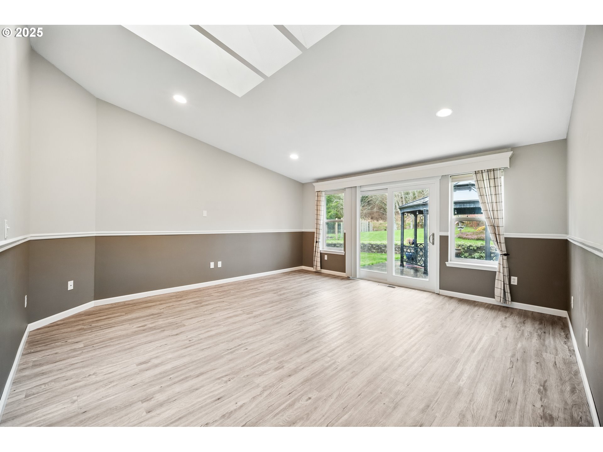 23 Elk Ridge Drive Cathlamet, WA 98612 - Photo 10 of 46 a view of an empty room with wooden floor and a window
