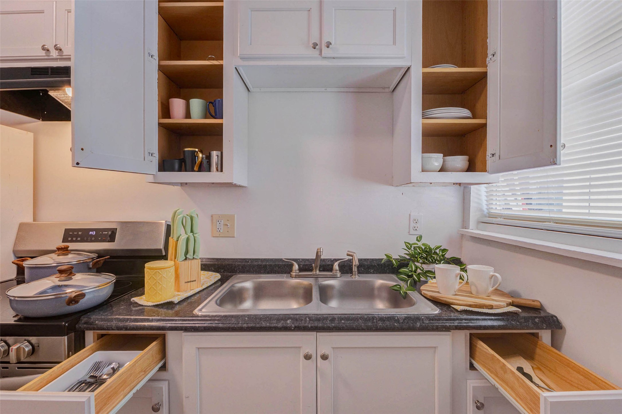 2902 Truxillo Street Houston, TX 77004 - Photo 27 of 32 a kitchen with a sink and cabinets