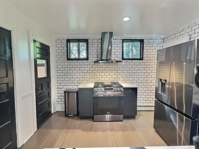 a bathroom with a bathtub and a sink