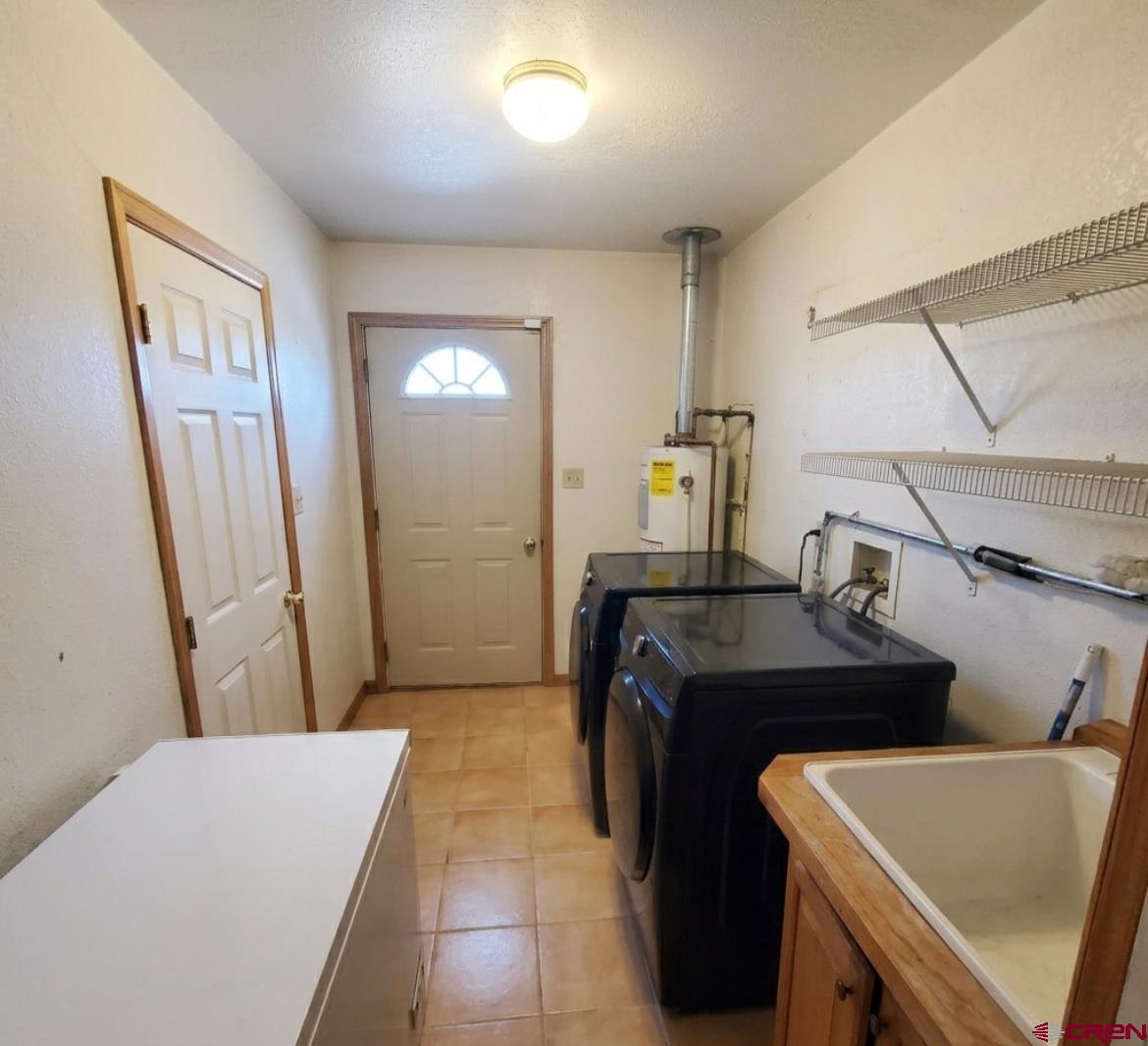816 Main Street Manassa, CO 81141 - Photo 23 of 23 a bedroom with a sink and a mirror