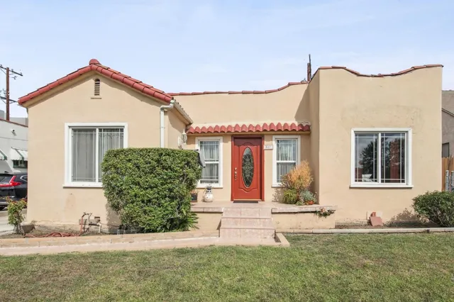 front view of a house with a yard
