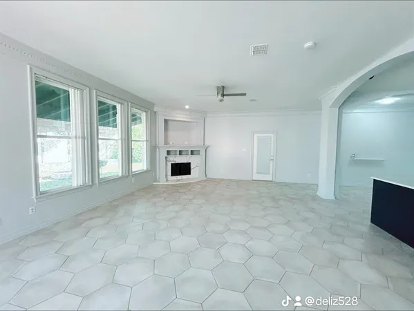 a view of an empty room with a window