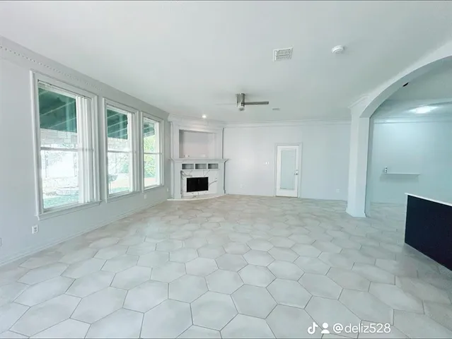 a view of an empty room with a window