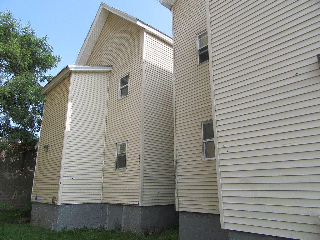 8-10 Stebbins Street Springfield, MA 01109 - Photo 8 of 9 a view of a white house with a small space