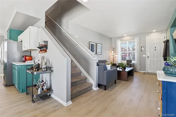 a view of entryway with livingroom and wooden floor