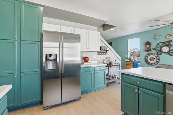 a utility room with cabinets dryer and washer