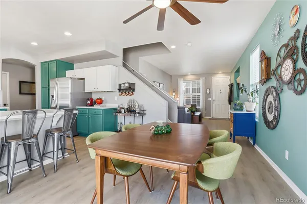 a view of a dining room with furniture and wooden floor
