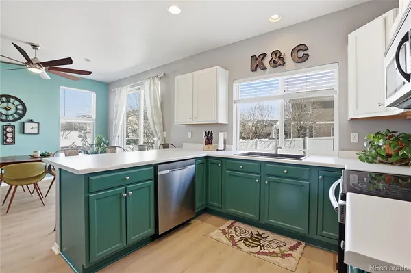 a kitchen with sink and window