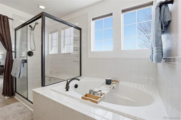 a bathroom with a tub and a shower