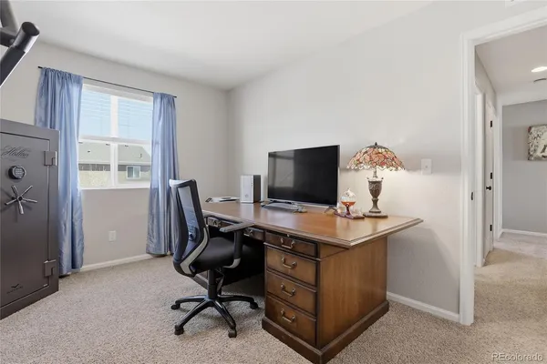 a view of a workspace with furniture