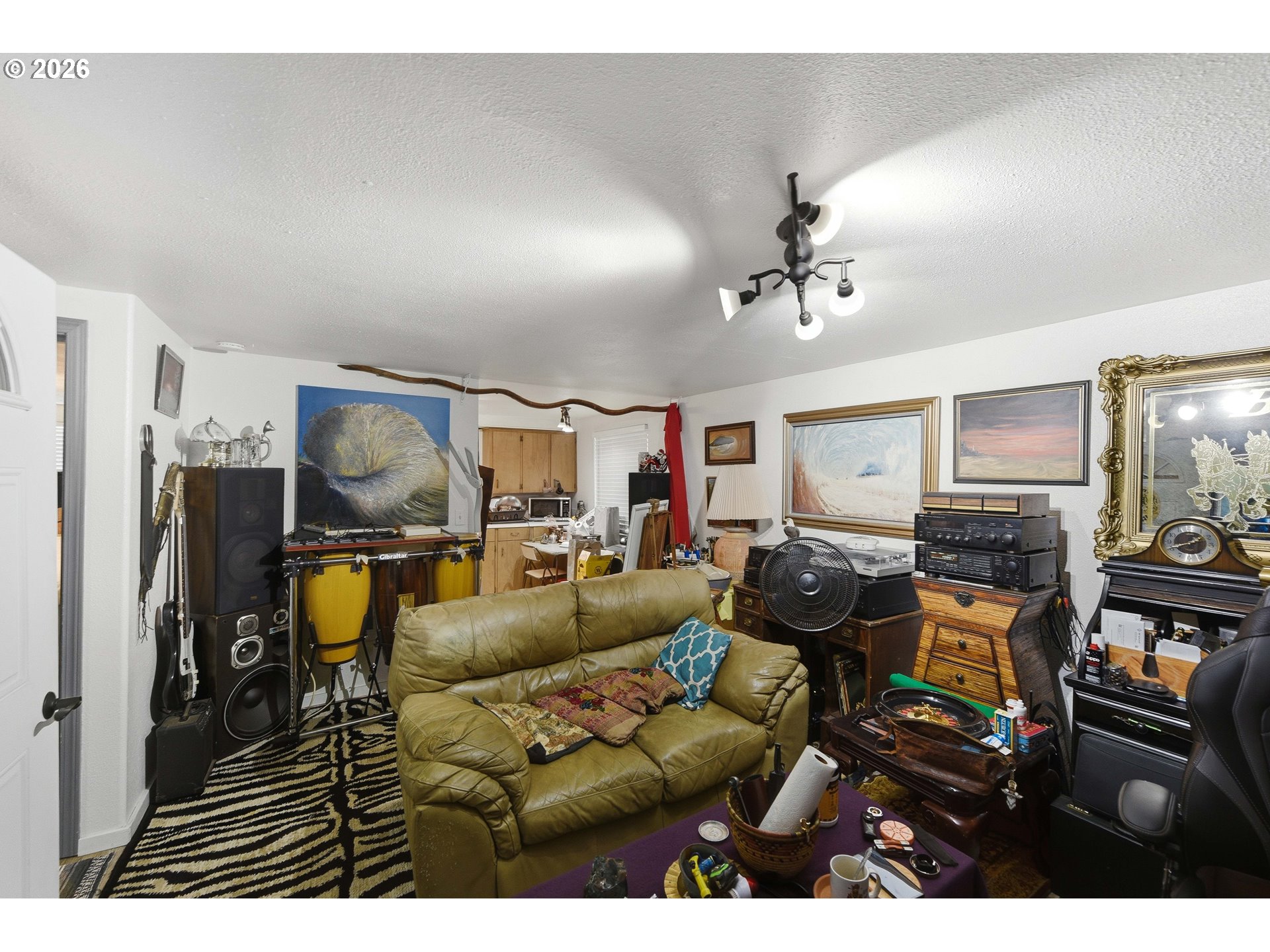 1955 Maple Street North Bend, OR 97459 - Photo 37 of 48 a living room with furniture and a flat screen tv