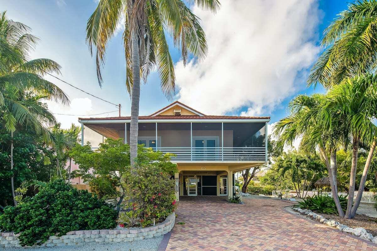 a view of a chairs and table in the backyard