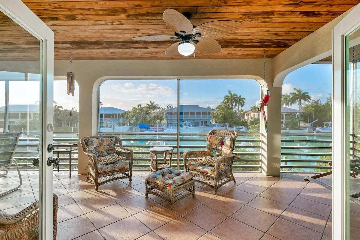1495 Copa D Oro Marathon, FL 33050 - Photo 2 of 41 a view of a patio with a table chairs and backyard