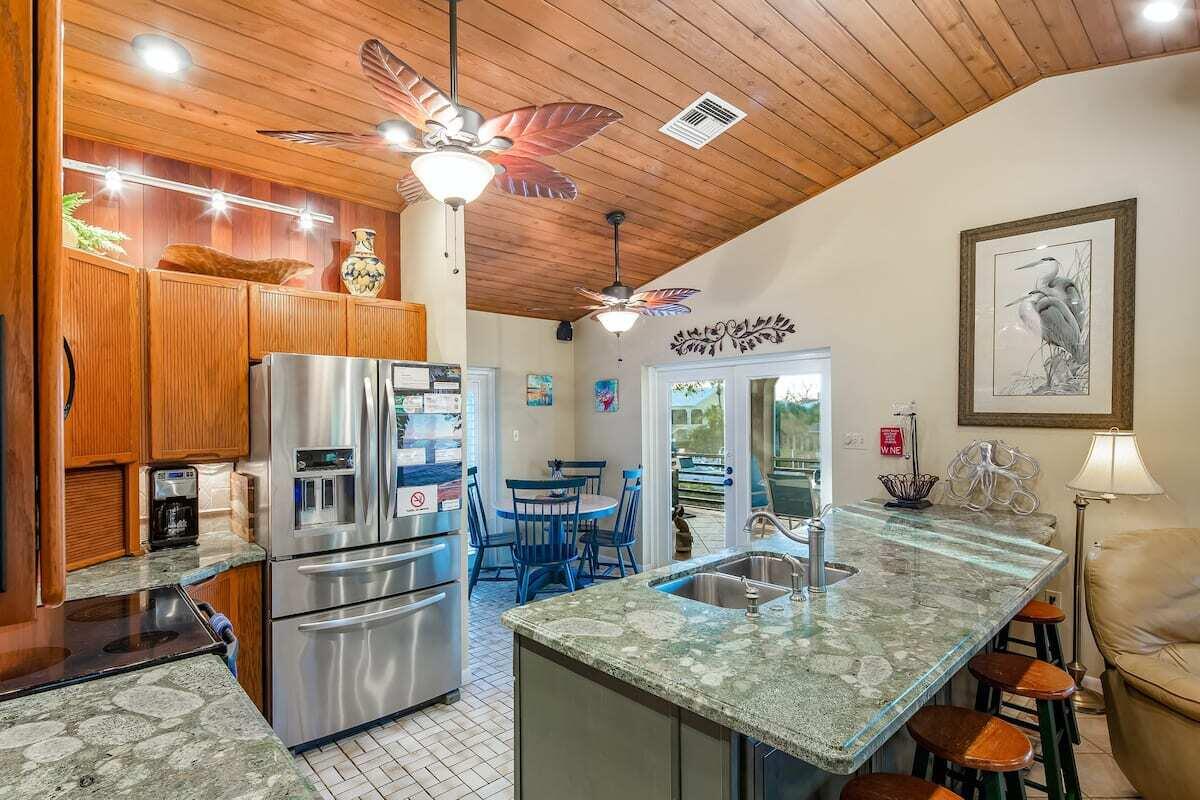 1495 Copa D Oro Marathon, FL 33050 - Photo 13 of 41 a kitchen with stainless steel appliances granite countertop a sink and cabinets