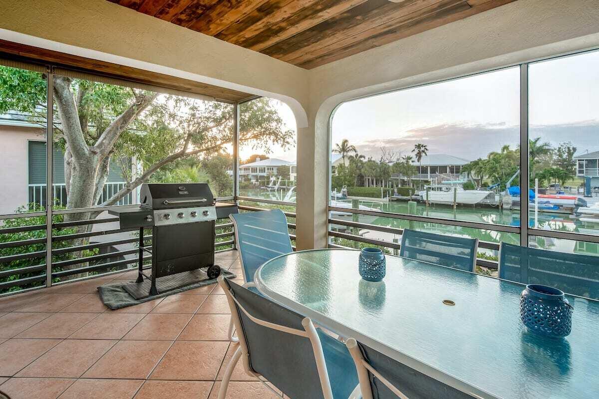 1495 Copa D Oro Marathon, FL 33050 - Photo 16 of 41 a kitchen with a sink and wooden cabinets