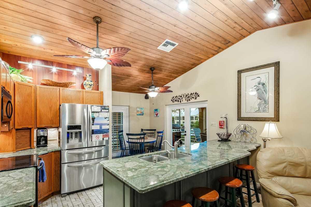 1495 Copa D Oro Marathon, FL 33050 - Photo 3 of 41 a kitchen with stainless steel appliances granite countertop a sink a stove and refrigerator