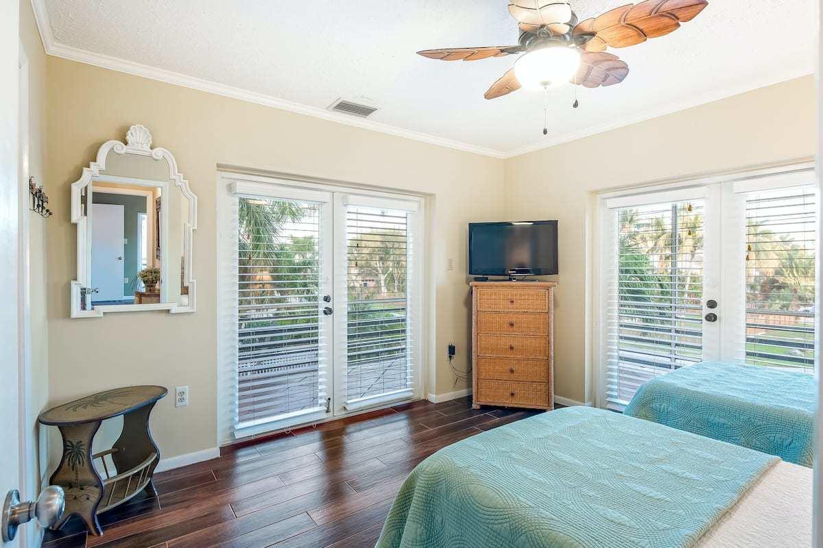 1495 Copa D Oro Marathon, FL 33050 - Photo 27 of 41 a bedroom with furniture and a flat screen tv