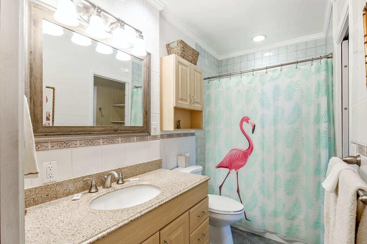 1495 Copa D Oro Marathon, FL 33050 - Photo 28 of 41 a bathroom with a granite countertop sink a toilet and shower