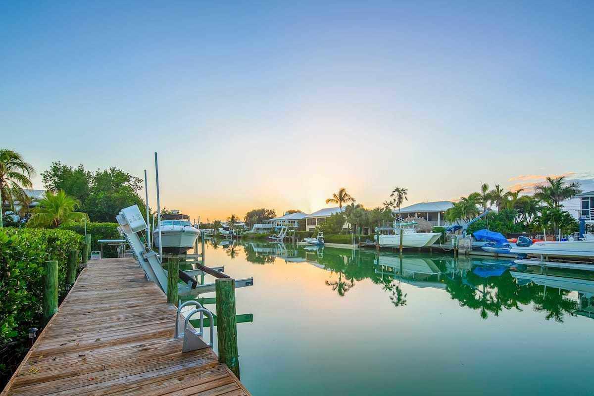1495 Copa D Oro Marathon, FL 33050 - Photo 4 of 41 a lake view with plants and large trees