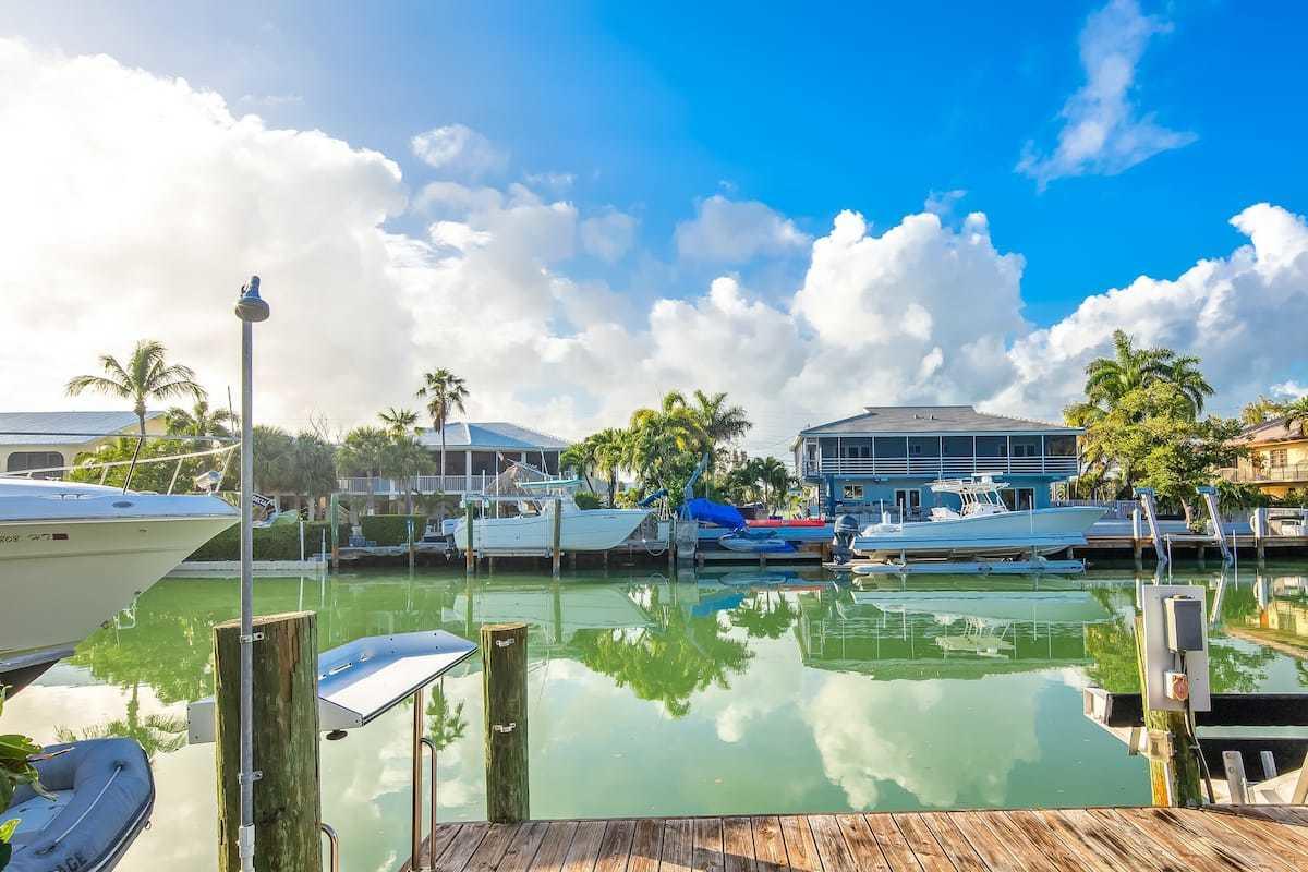1495 Copa D Oro Marathon, FL 33050 - Photo 40 of 41 a view of a lake with a big yard and large trees