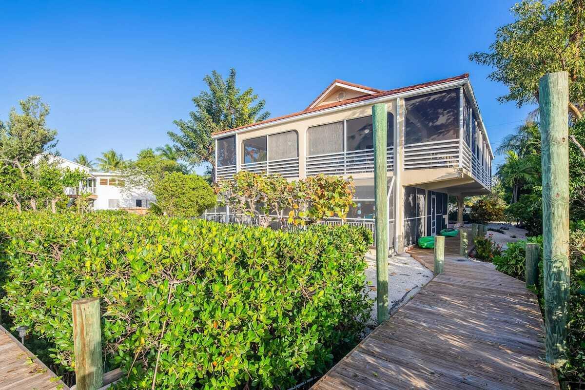 1495 Copa D Oro Marathon, FL 33050 - Photo 5 of 41 a front view of a house with a garden