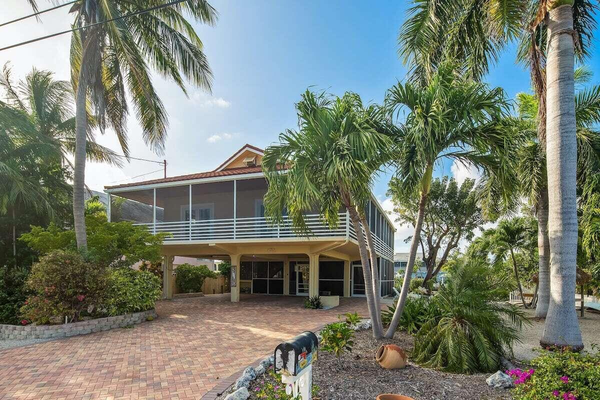 1495 Copa D Oro Marathon, FL 33050 - Photo 7 of 41 a front view of a house with a garden