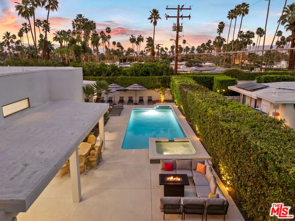 1414 Sagebrush Road Palm Springs, CA 92264 - Photo 7 of 48 a terrace with outdoor seating and city view