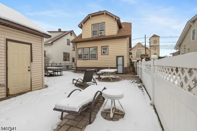 a view of a roof deck with furniture