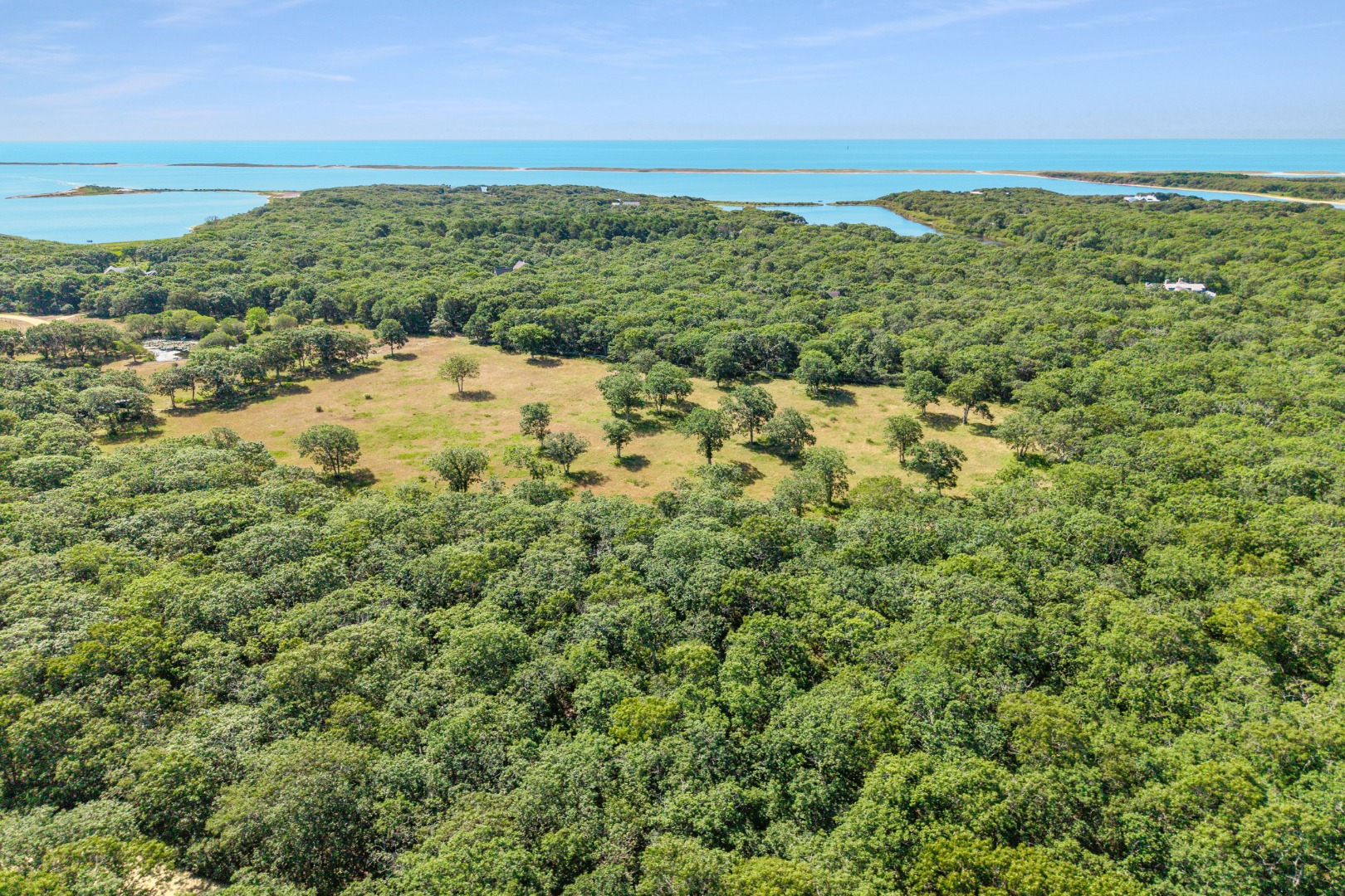 3 Jacob's Neck Road Edgartown, MA 02539 - Photo 1 of 14 a view of a field with an ocean