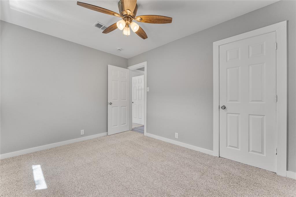 709 North Rita Street Lacy-Lakeview, TX 76705 - Photo 16 of 32 an empty room with chandelier fan