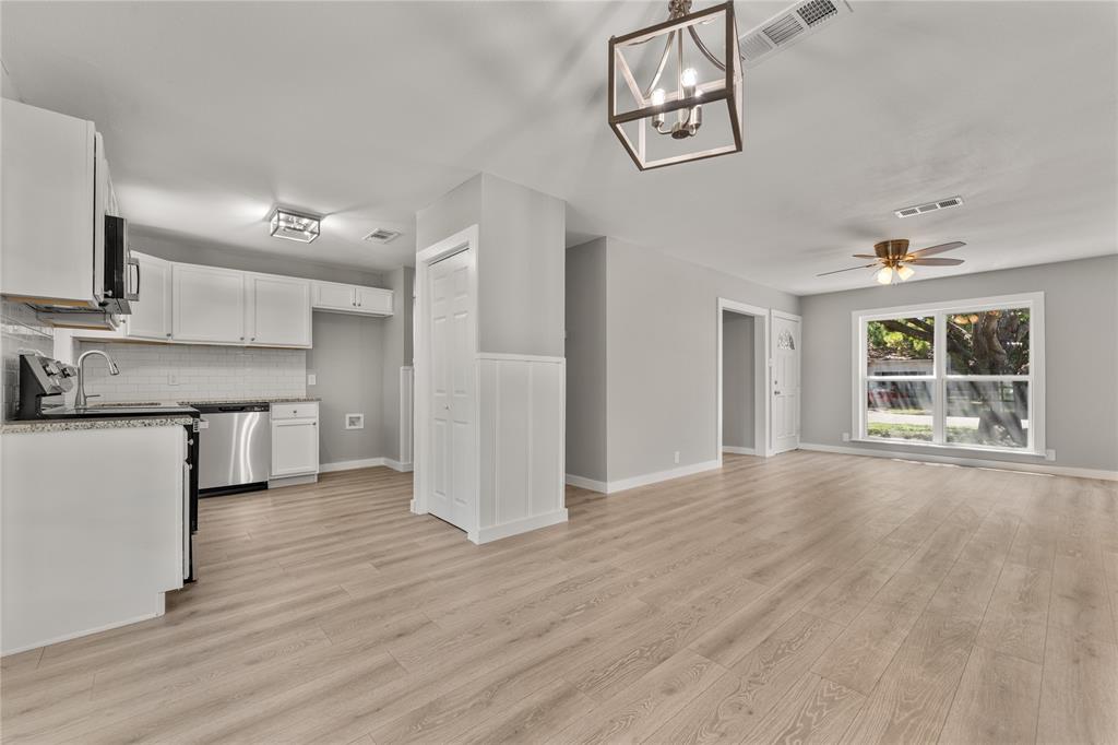 709 North Rita Street Lacy-Lakeview, TX 76705 - Photo 20 of 32 a view of a kitchen with a sink cabinet and a window