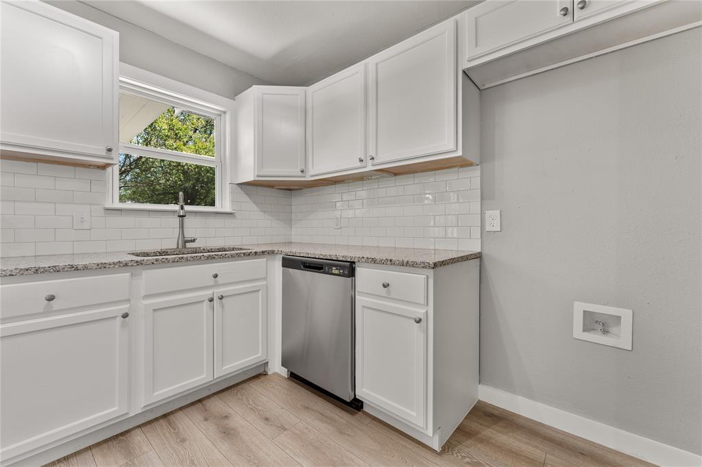 709 North Rita Street Lacy-Lakeview, TX 76705 - Photo 25 of 32 a kitchen with white cabinets appliances and a sink