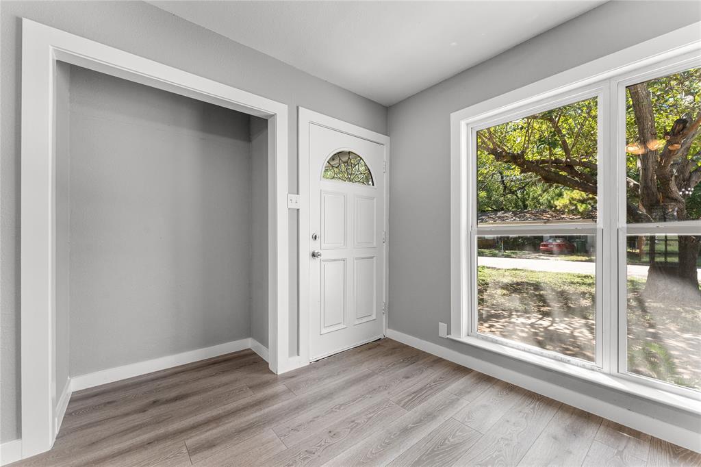 709 North Rita Street Lacy-Lakeview, TX 76705 - Photo 5 of 32 an empty room with wooden floor and windows