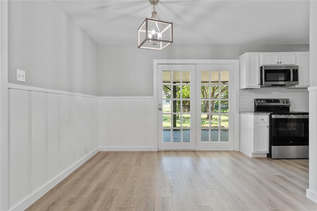 709 North Rita Street Lacy-Lakeview, TX 76705 - Photo 10 of 32 wooden floor in an empty room with a window